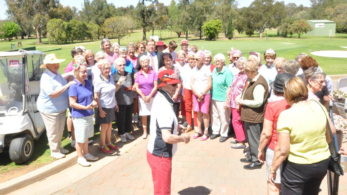 BIG CROWD: The presentation of the award was a surprise for Tina Beggs, after the regular ladies' competition at Dubbo Golf Club. Photo: CONTRIBUTED