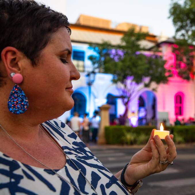 Rochelle Olsen lighting a candle for Pregnancy and Infant Loss Awareness Day in 2019. Photo: CONTRIBUTED