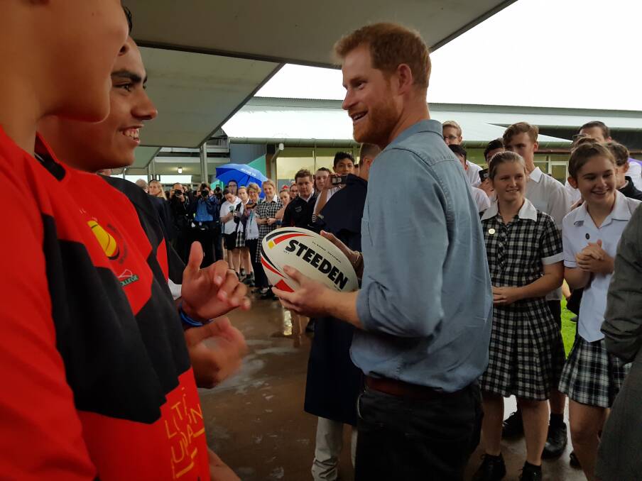 Prince Harry talks with Kyjuan Crawford, who gave him a Clontarf Foundation ball. 