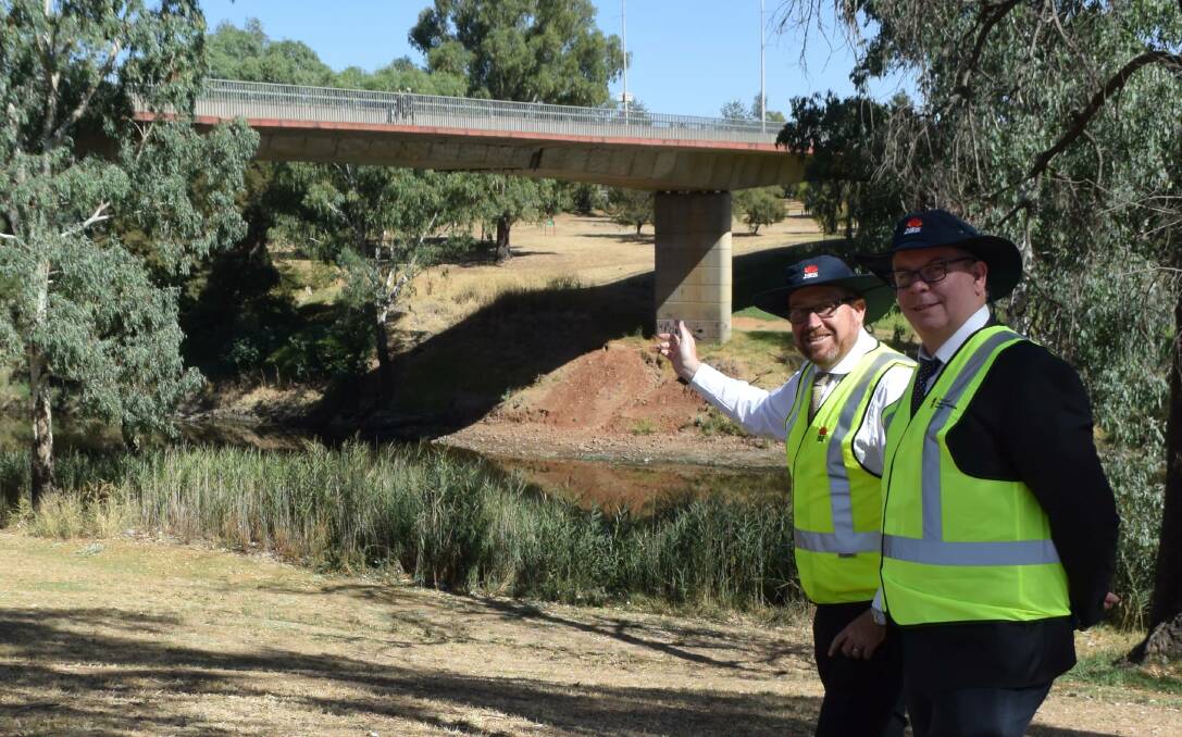 WORK: Former Dubbo MP Troy Grant and RMS western region director Alistair Lunn under the LH Ford Bridge. Photo: FILE