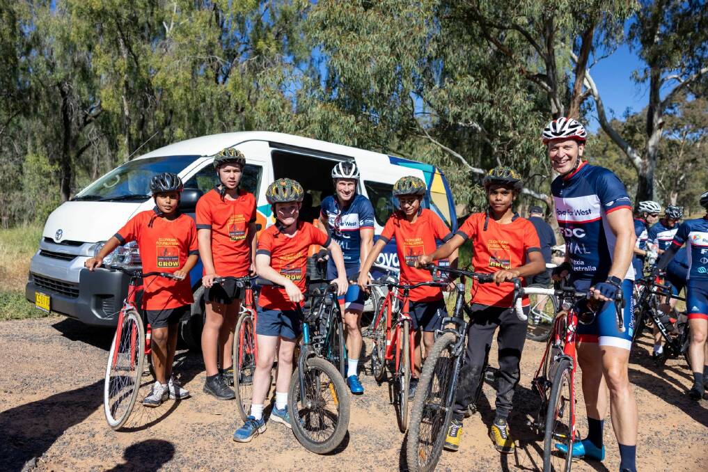 JOINING IN: Narromine Clontarf participants with ride ambassadors Mark Renshaw (centre) and Daniel Gibson (left). Photo: CONTRIBUTED