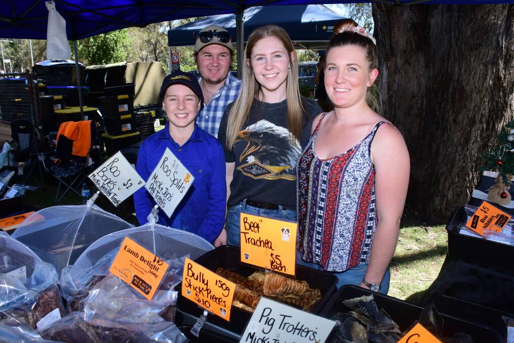 SPONSORSHIP FOR MARKETS: Caleb McGrath with Rodney, Jenni and Alayna Tink from Mick & Jen's Pet Treats at the Dubbo Farmers Markets on Saturday. Photo: AMY McINTYRE