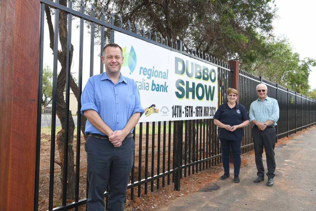 WORK CONTINUES: Dubbo mayor Ben Shields, with Dubbo Show Society secretary Sue Hood and Chris Edwards in front of the new fence. Photo: CONTRIBUTED