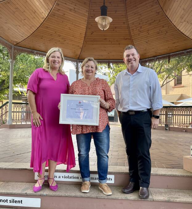 CONGRATULATIONS: NSW Minister for Regional Health Bronwyn Taylor and Dubbo MP Dugald Saunders presenting Lorraine Holland with her award. Picture: CONTRIBUTED