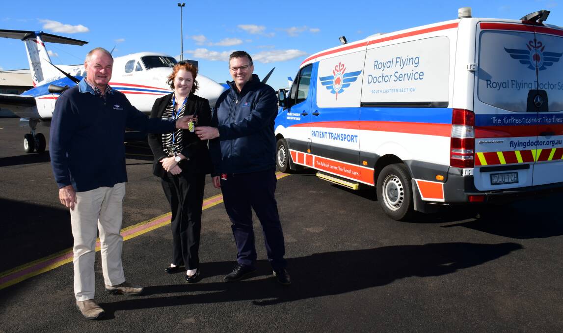 EXPANDING: The Royal Flying Doctor Service's Terry Clark, Kendall Graham and Darren Borger at the handover of the keys last week. Photo: BELINDA SOOLE