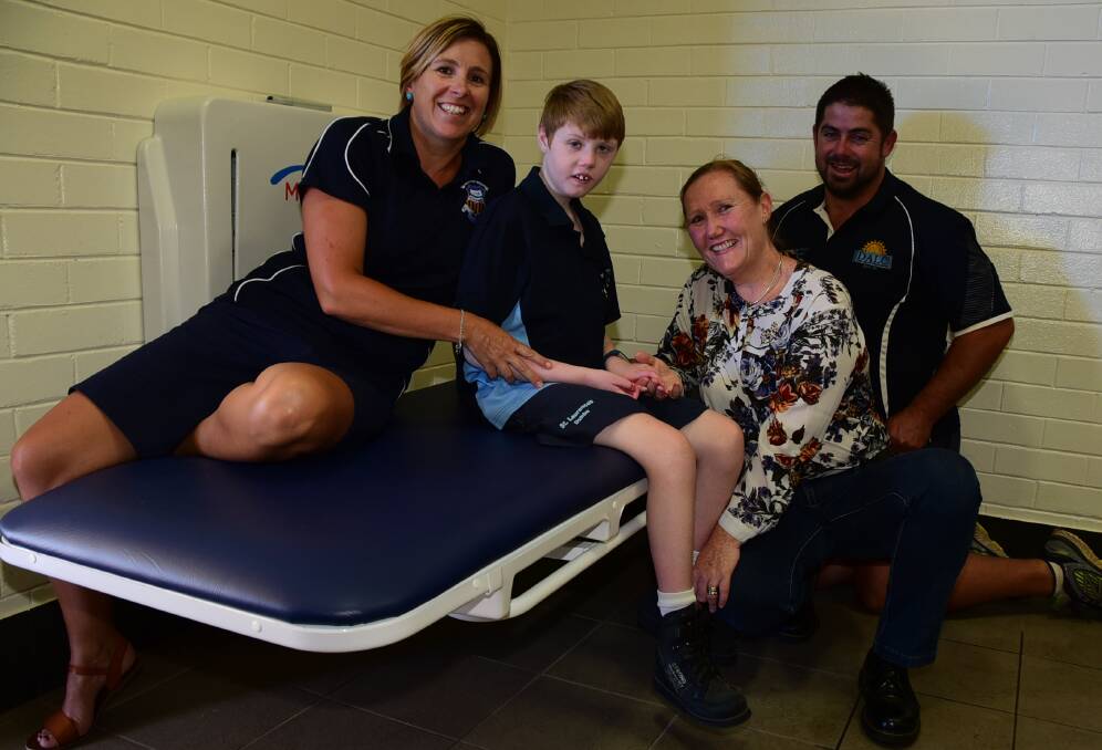 CHANGES AT THE POOL: Miranda Richardson, Isaac Minney, Anna Minney and Dubbo Aquatic Leisure Centre manager Nick Wilson with the new table. Photo: PAIGE WILLIAMS