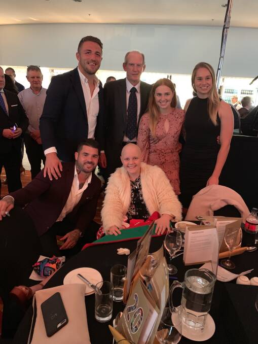 Maddi and Molly Croft with Sam Burgess, Wayne Bennett, Kezie Apps and Adam Reynolds. Photo: CONTRIBUTED