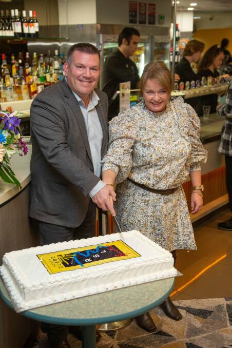 Dugald Saunders and Rebecca Zaia mark the official opening with cake. Photo: CONTRIBUTED