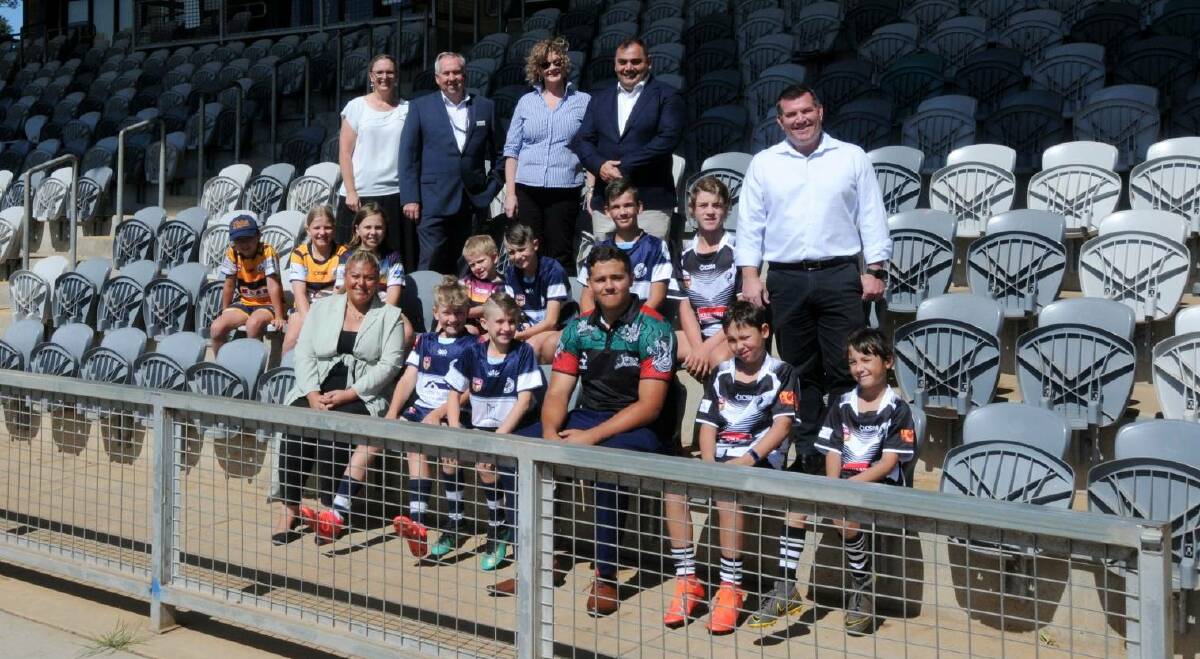 SELL-OUT: Dubbo Regional Council and Souths Cares staff with and Dubbo MP Dugald Saunders and local juniors ahead of the 2021 match. Picture: NICK GUTHRIE