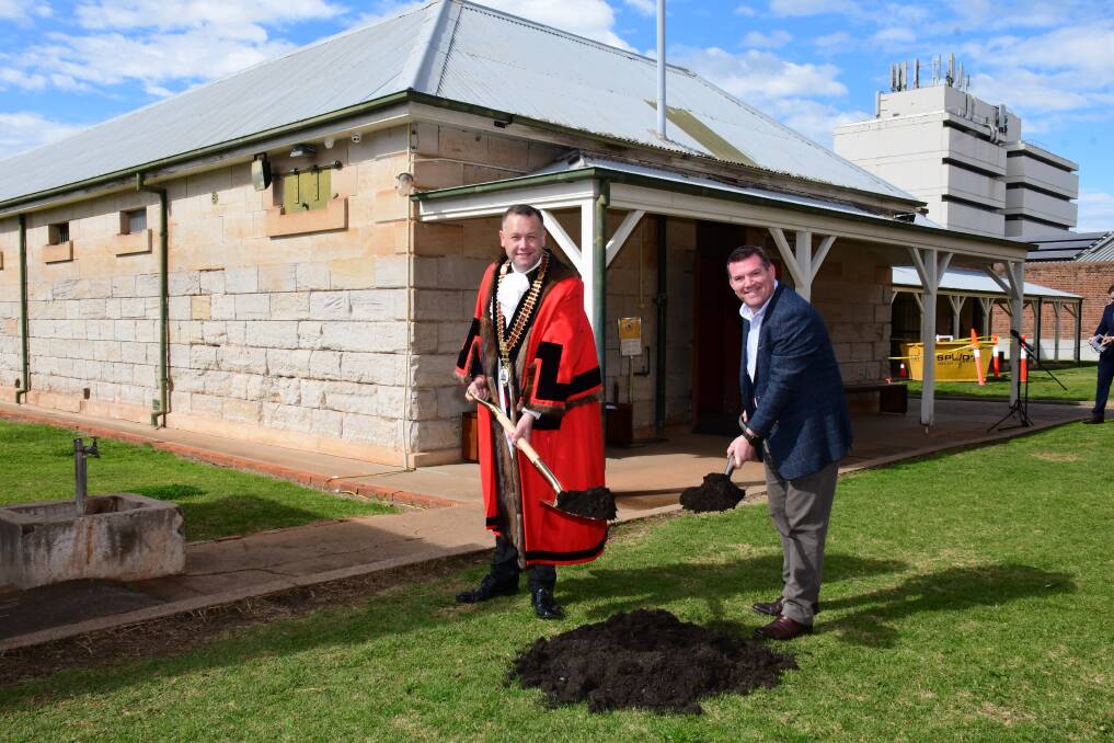Dubbo mayor Ben Shields and MP Dugald Saunders turning the sod on the gaol's redevelopment. Photo: BELINDA SOOLE