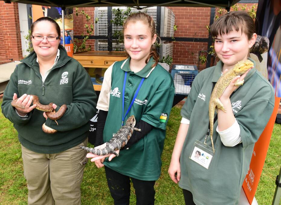 EXHIBITORS GALORE: Casey Towns, Lisa Bayliss and Julie Bayliss from Taronga Western Plains Zoo at last year's festival. Photo: FILE