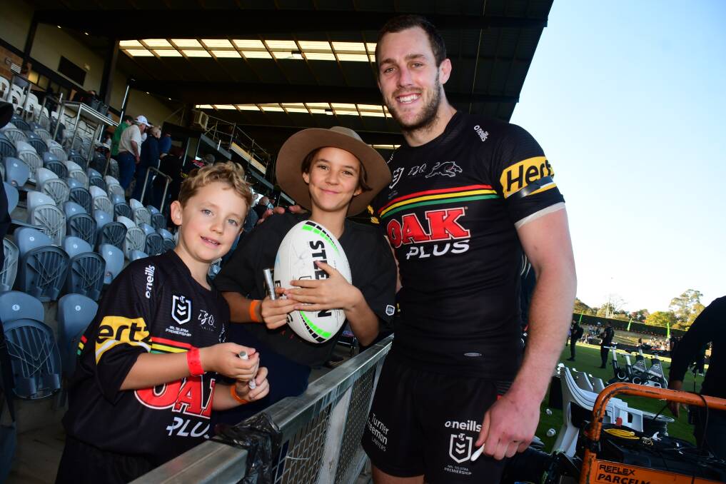 GREAT BENEFITS: Penrith Panthers' Isaah Yeo with young fans Solly and Latai Day at the NRL match in May. Photo: AMY McINTYRE 