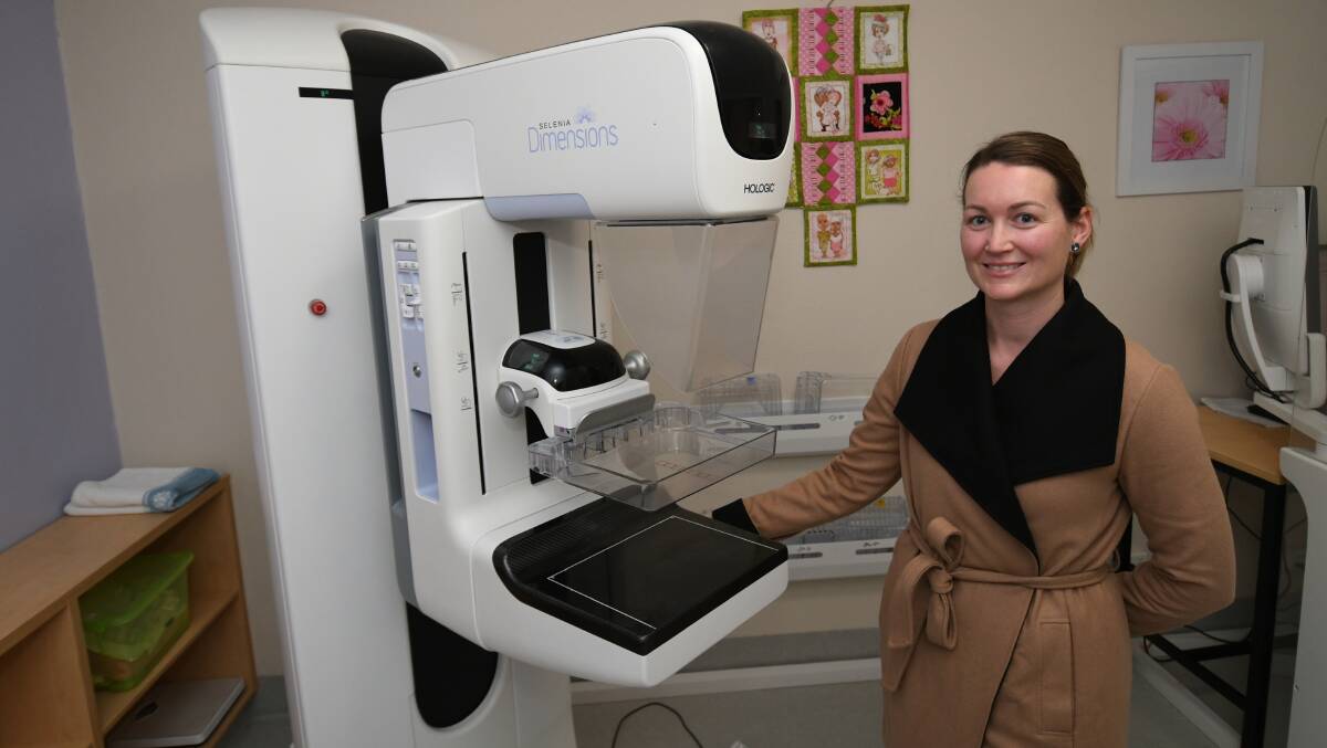 BACK IN ACTION: BreastScreen NSW health promotions officer Kay Smith with a breast screening unit. Photo: CHRIS SEABROOK