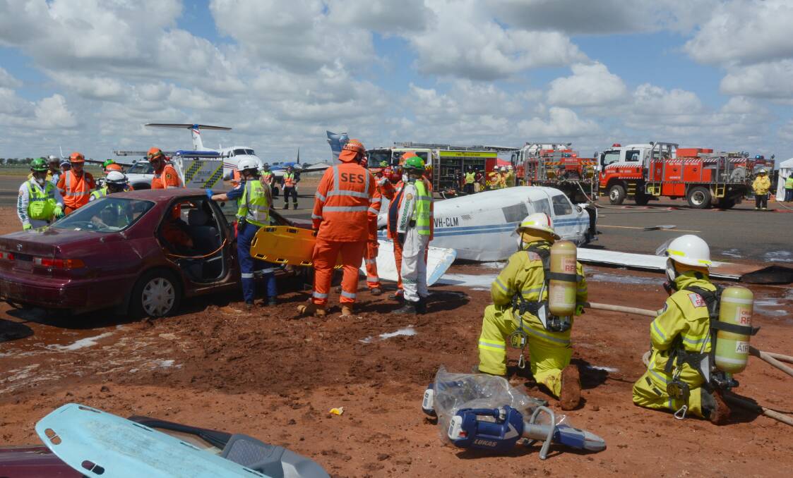 PLANE CRASH: Emergency services from across Dubbo were called to respond to a simulated crash between two planes taxiing on the airport runway. Photo: ORLANDER RUMING