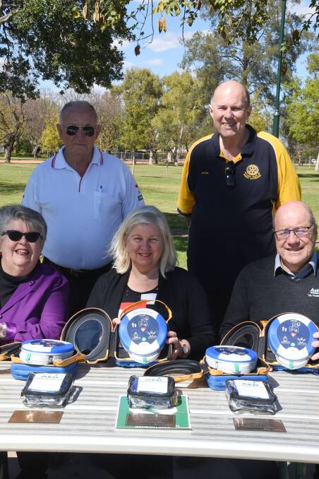 PUSH FOR MORE: George Chapman, Peter McInnes, Janice Willets, Kim O'Connor and Stuart Astley with the last defibrillators that were donated to the Heart-Safe City campaign. Photo: ORLANDER RUMING