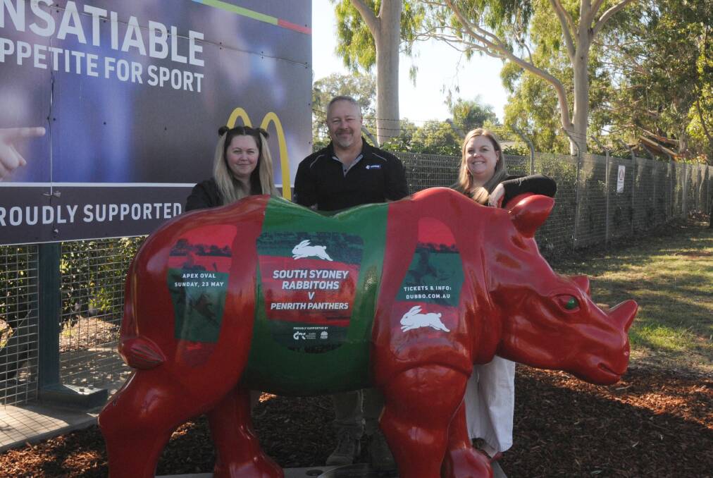 EXCITED FAN: Local South Sydney fan Zac Etcell (centre) donated and volunteered to paint the Rhino at Apex Oval ahead of the NRL game between South Sydney and Penrith in May. Photo: TOM BARBER