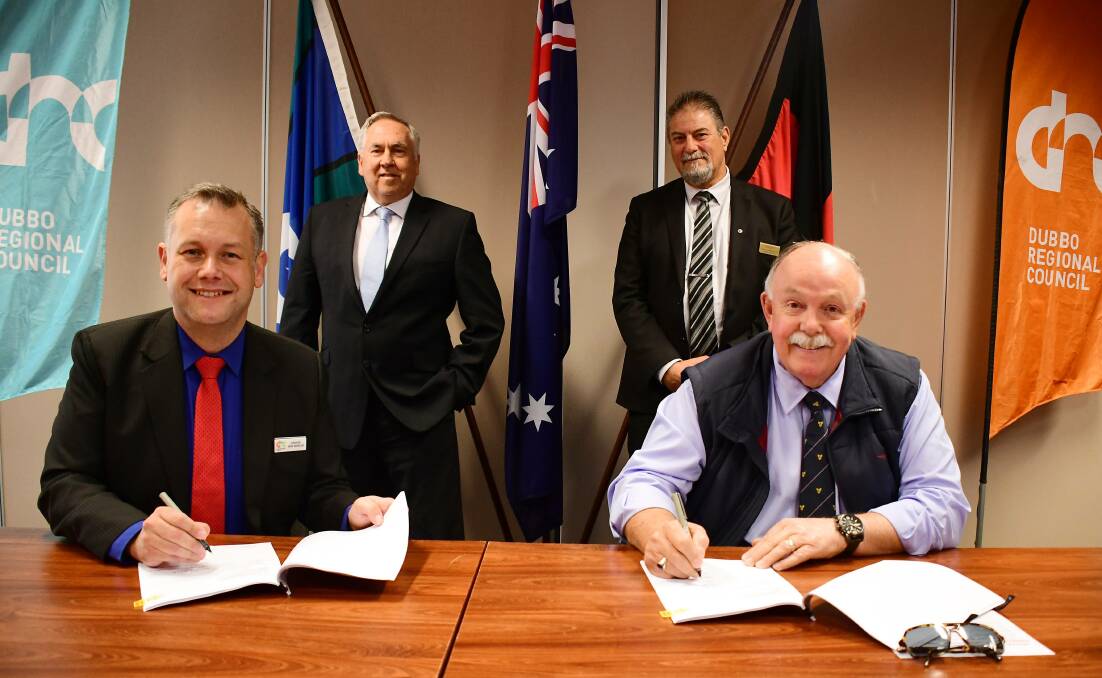 Former mayor Ben Shields and former Dubbo Regional Council CEO Michael McMahon with Dubbo RSL Club manager Gus Lico and president Jeff Caldbeck, signing the agreement. Picture by Belinda Soole
