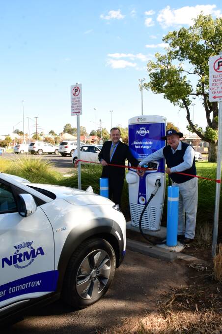 CHANCE TO PLUG IN: Dubbo Regional mayor Ben Shields and council's economic development officer Edward Joshua opening the NRMA fast charger. Photo: BELINDA SOOLE