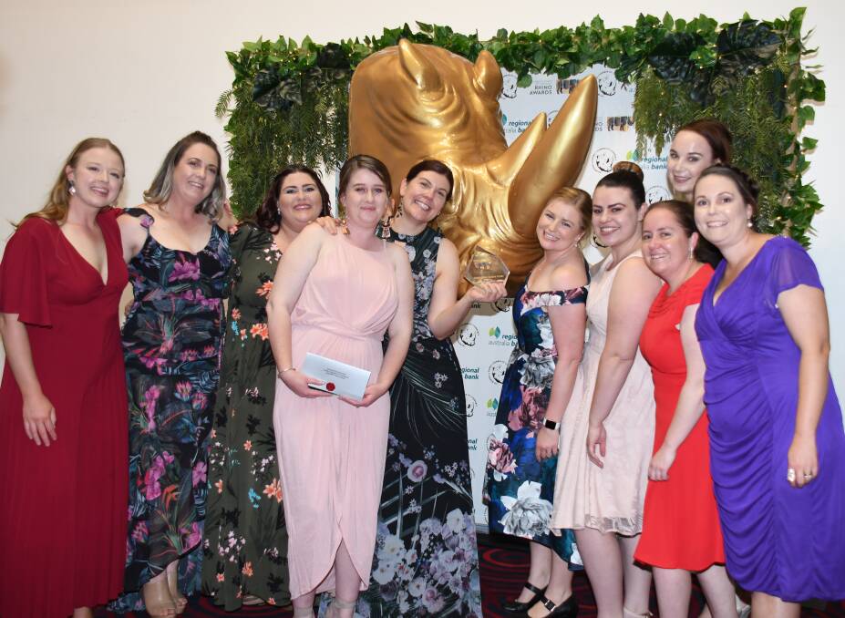 WINNERS ARE GRINNERS: Regand Park Early Childhood Education Centre director Justine Richards with her team. Photo: AMY McINTYRE