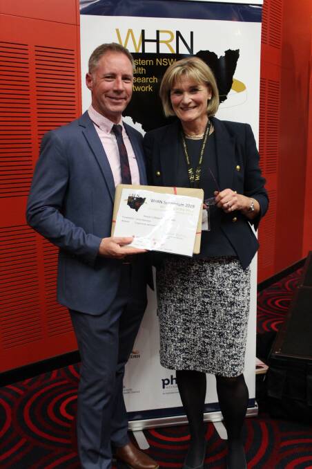 ONLINE EVENT: Western NSW local health district CEO Scott McLachlan and Western NSW Health Research Network founding chair Catherine Hawke at last years symposium in Dubbo. Photo: CONTRIBUTED