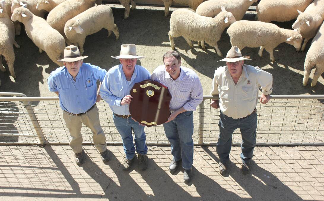 WINNERS ARE GRINNERS: Tim Sampson, Andrew Peadon, Ross McCarthy and Peter Brain with the Animal Welfare in Saleyards and Lairages Award for the Dubbo Regional Livestock Markets. Photo: CONTRIBUTED