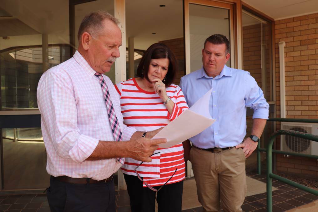 Narromine Shire mayor Craig Davies showing plans for the site to Minister for Local Government Shelley Hancock and Member for Dubbo Dugald Saunders in November. Photo: ZAARKACHA MARLAN