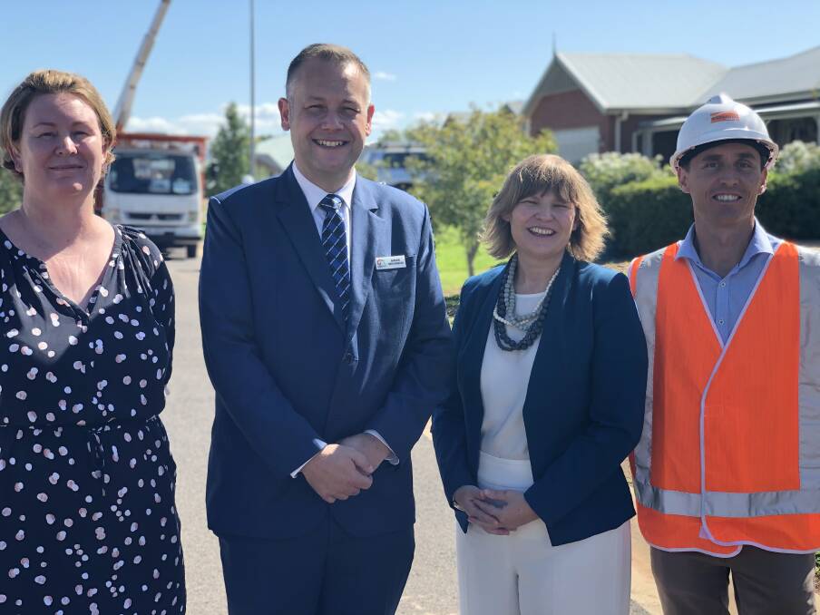 PLANS IN ACTION: Dubbo Regional Council's Catriona Jennings, mayor Ben Shields, and Skye Price with Andrew Tomlins from Essential Energy when the LED replacement program started. Photo: CONTRIBUTED