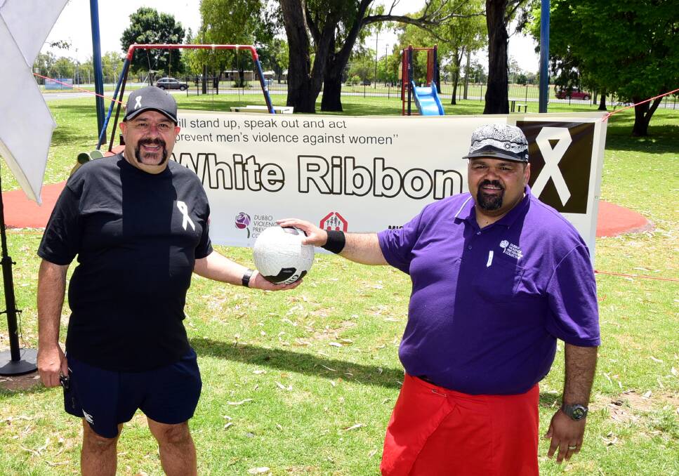 White Ribbon Ambassador Kevin Saul and Kevin Jones at last year's White Ribbon Day netball game to raise awareness for domestic violence. Photo: BELINDA SOOLE
