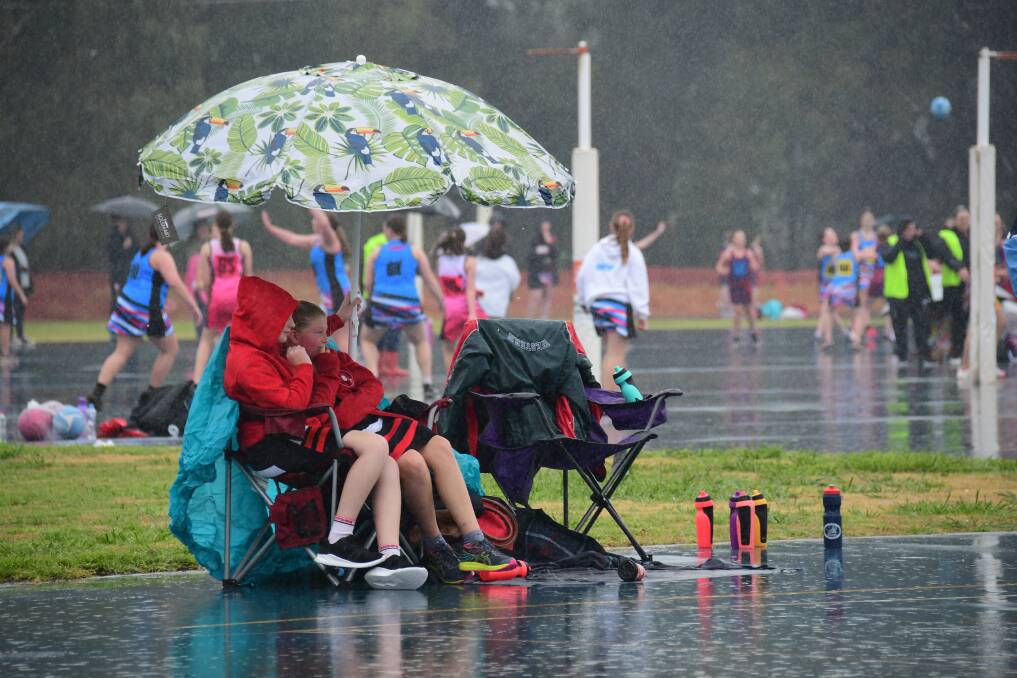 RAINY SPORTS DAY: The rain didn't stop weekend sport like the netball, which had its first round on Saturday. Photo: AMY McINTYRE