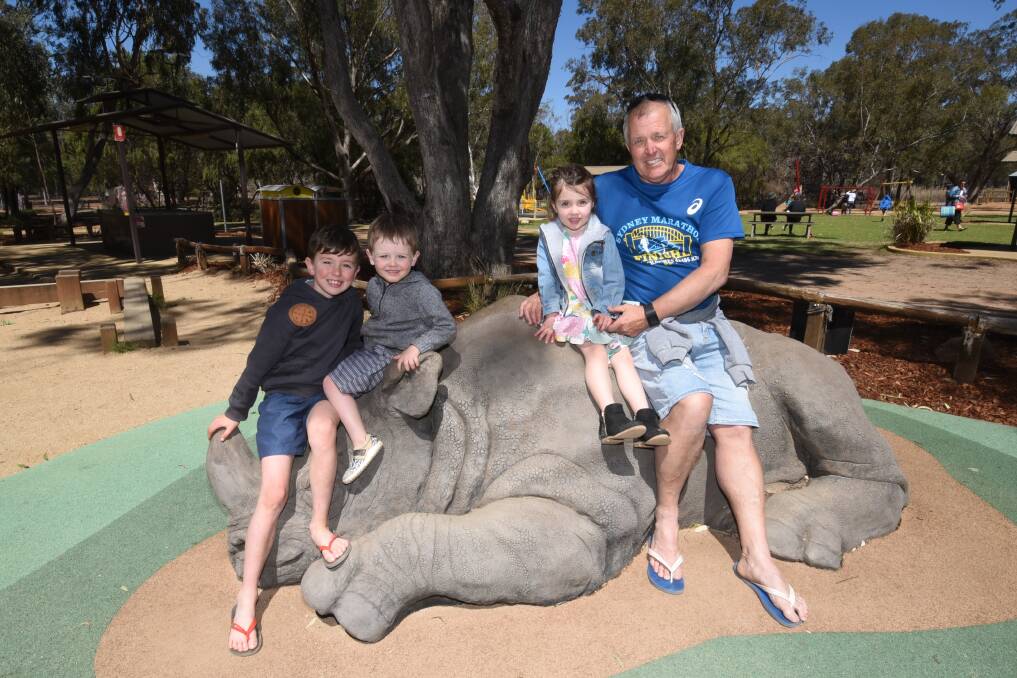 Families such as Kobi McNamara, Clancy Moore, Marli McNamara and Greg Moore - pictured at Taronga Western Plains Zoo - will be targeted in the campaign. Photo: AMY McINTYRE