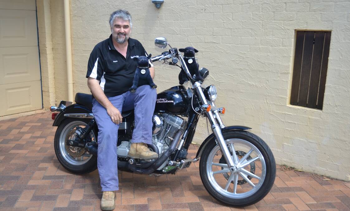 SHARING STORIES: Black Dog Ride Dubbo/NSW coordinator Wayne Amor, pictured with his Winston dogs (named after Winston Churchill who had depression), says the event has raised more than $35,000 for Lifeline Central West. Photo: ORLANDER RUMING