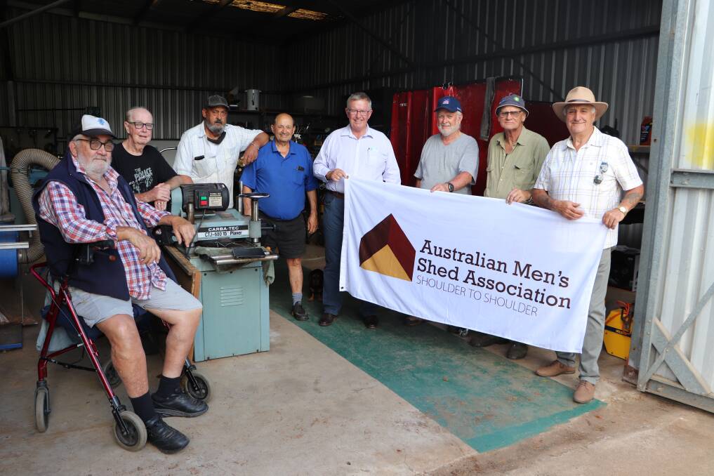 HAPPY DAYS: Federal member for Parkes Mark Coulton with the members of the Mendooran Men's Shed. Picture: CONTRIBUTED