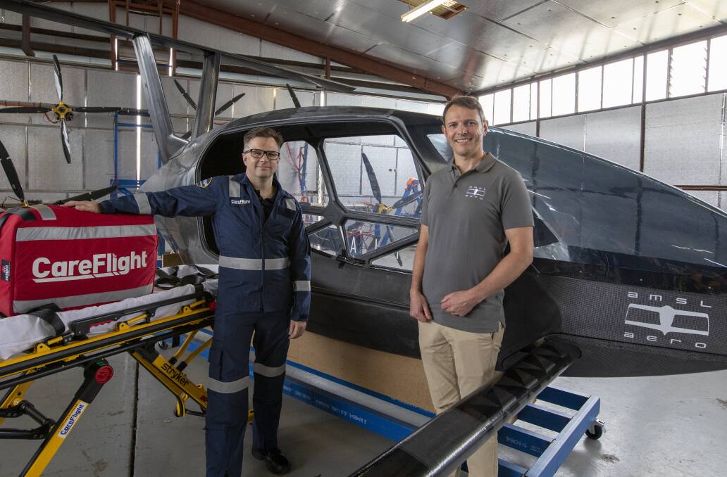 INNOVATION: CareFlight medical director Toby Fogg and AMSL Aero cofounder Andrew Moore with the electric air ambulance. Photo: CONTRIBUTED