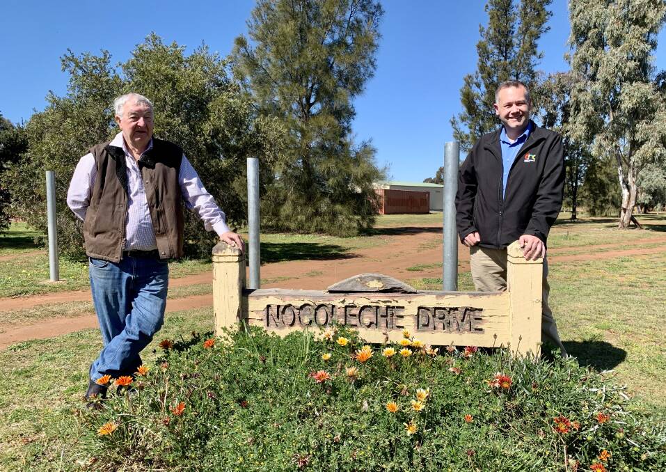 FALLING APART: Firgrove Executive Committee member Ross Sawtell and Dubbo mayor Ben Shields want to ensure the signs still have character if they're replaced. Photo: CONTRIBUTED