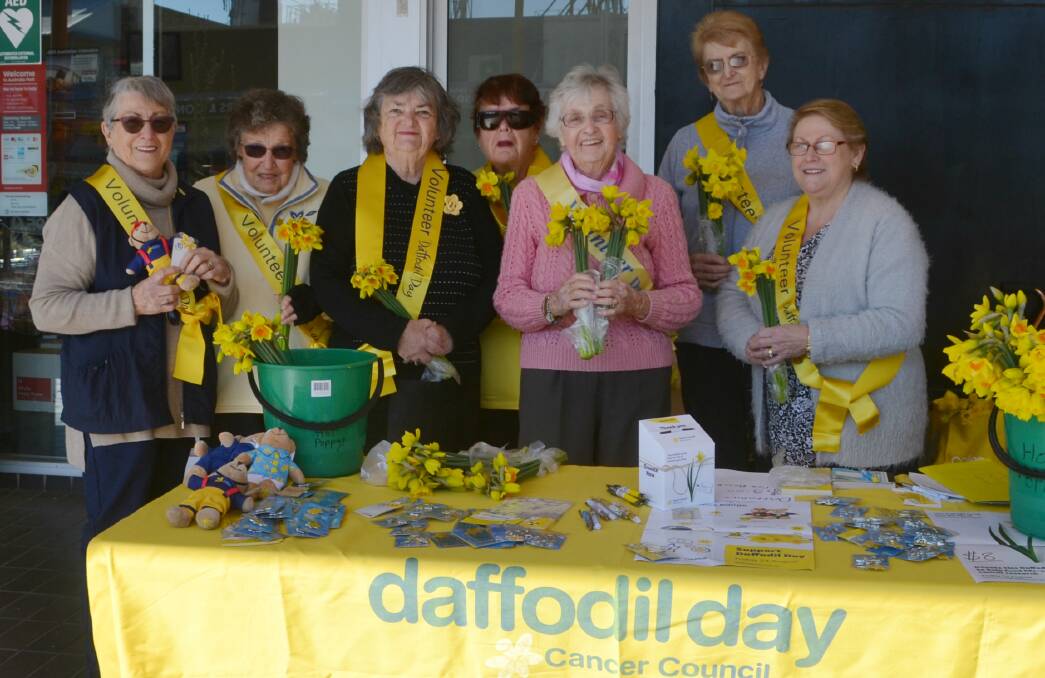 SYMBOL OF HOPE: Dubbo Cancer Support Group members Cath Lumber, Anne Sharpe, Nacny Farrell, Lorraine Scoble, Flo Ashby, Yvonne Evans and Anne Matthews at least year's stall. Photo: TAYLOR JURD