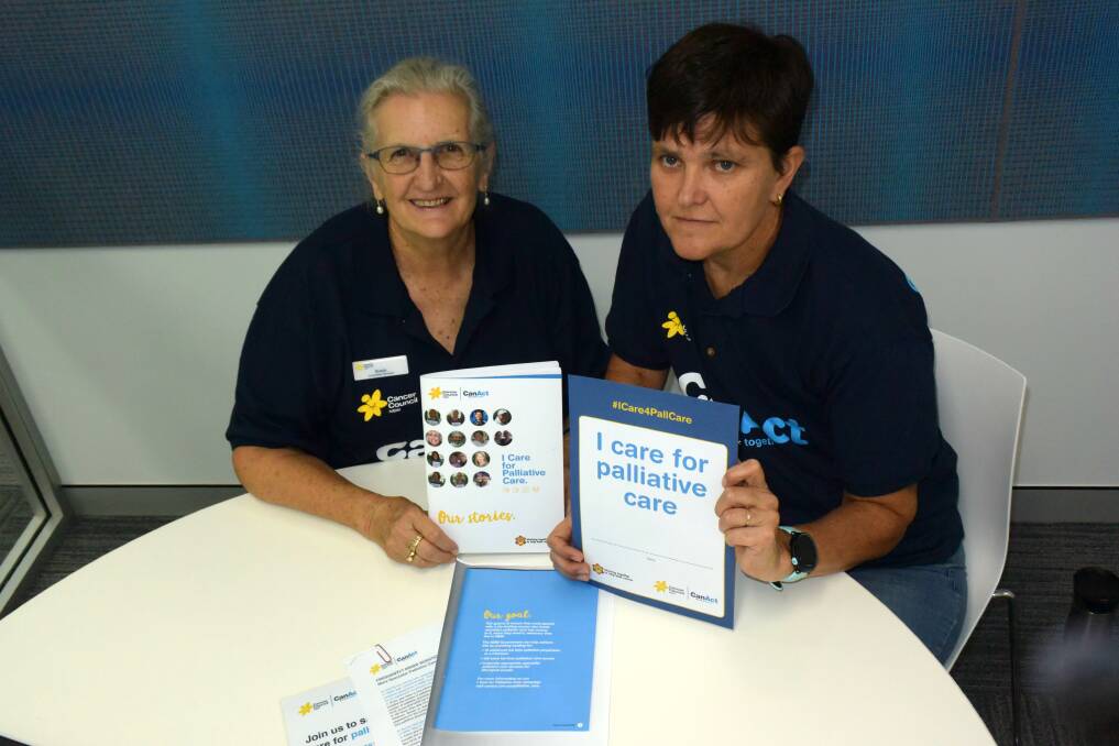 PUSH FOR CARE: Cancer Council ambassadors Susie Hill and Trish Taylor with last year's I Care for Palliative Care petition. Photo: ORLANDER RUMING