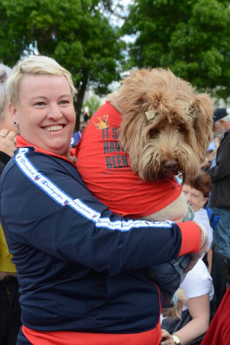 ROYAL RECEPTION: Tammy Kirchner with her dog Harlee, who travelled more than 300 kilometres to meet the Duke of Sussex. Photo: ORLANDER RUMING