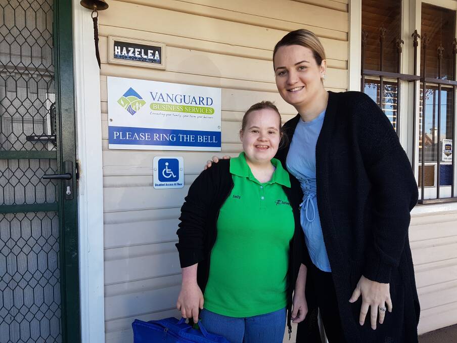 Emily Gardner from Go Get Em with her support worker Keira. Photo: CONTRIBUTED