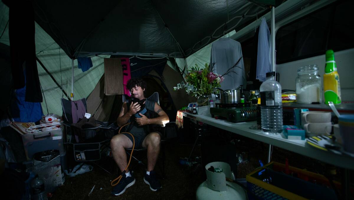 Damien Rose in what was home for a couple months - an old campervan and tent at the Coraki evacuation centre. Photo: Marina Neil. 