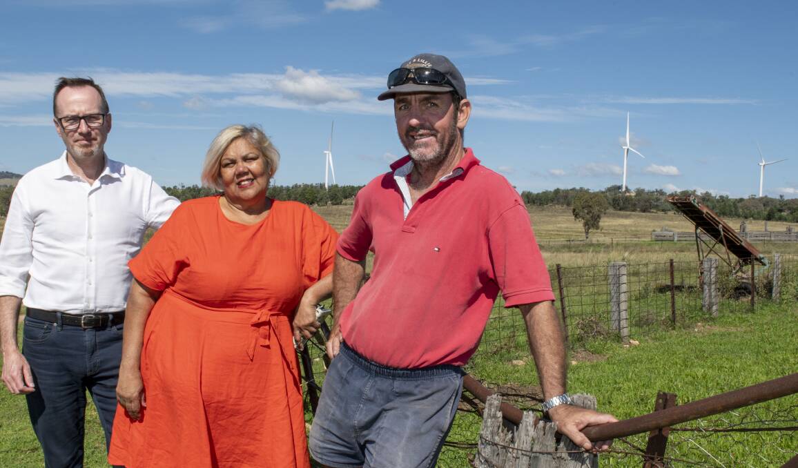 A NEW PLAN: Greens party members David Shoebridge and candidate Trish Frail with local grazier Simon Barton near the Bodangora wind farm. Photo: Belinda Soole