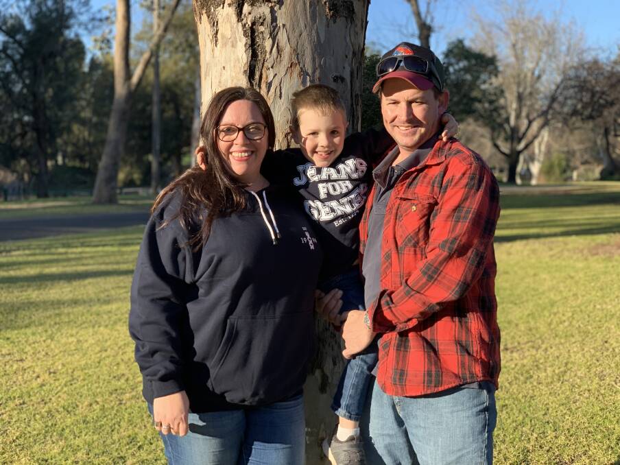 HAPPY FAMILY: Cassie with Charlie and Travis in Mudgee. Charlie was rocking double-denim and a Jeans for Genes t-shirt. Photo: Benjamin Palmer