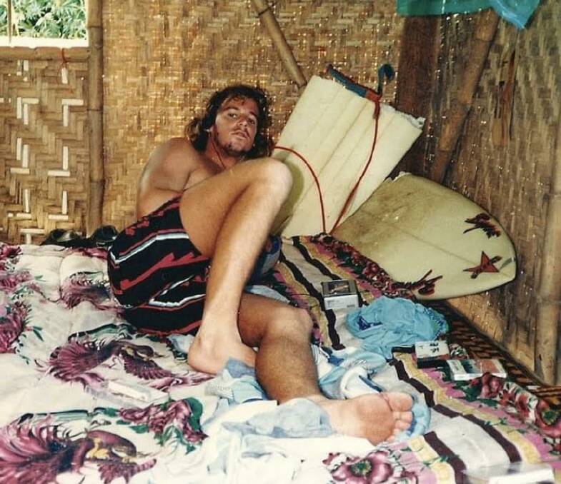 SOUL SURFER: Darren Hayes and his broken board after surfing Indonesia's famous G-Land break in 1986. Picture: Supplied.