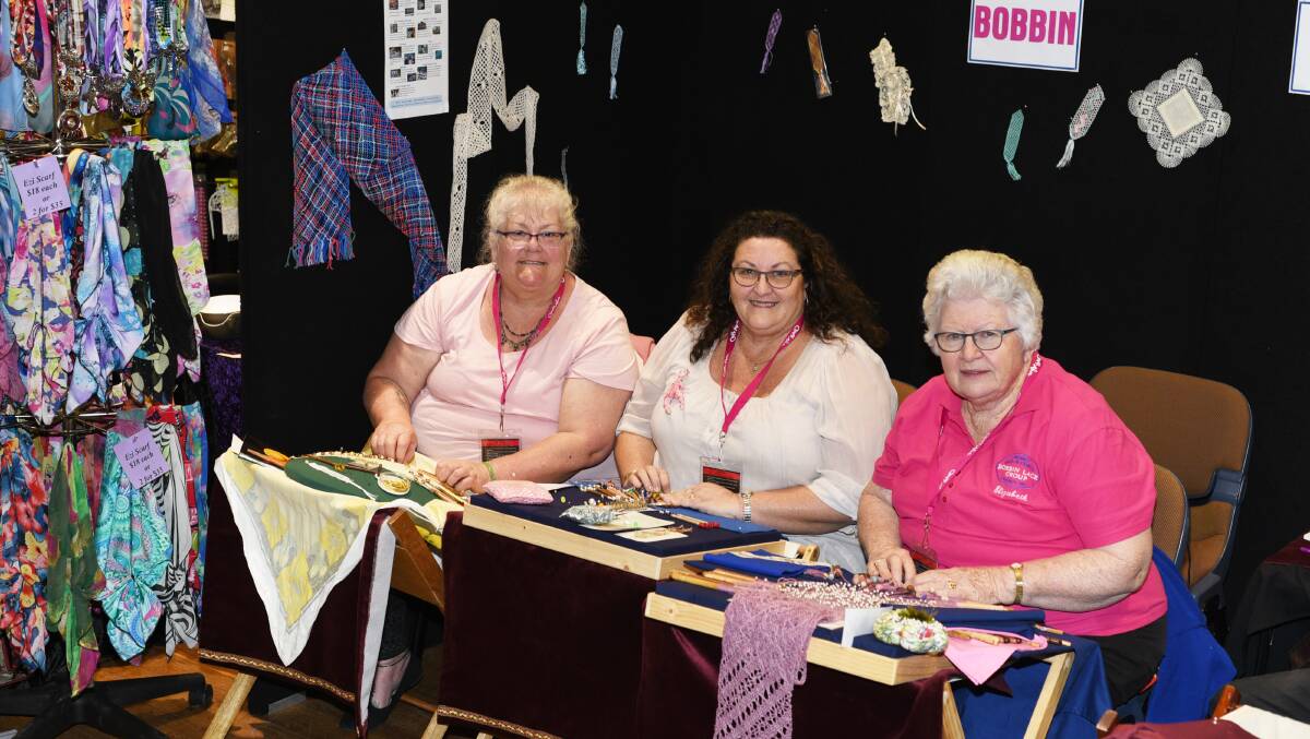 Fine work: Dubbo Bobbin Lace Group member Elizabeth Allen (right) shares her skills with Michelle Day and Tracy Hansen. Photo: AMY MCINTYRE.
