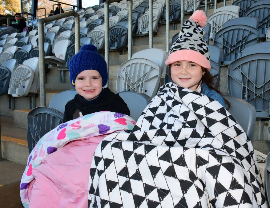 WINTER CHILL: Robey McMillian celebrated his fourth birthday shivering at the football with Marley McMillan. Photo: AMY McINTYRE