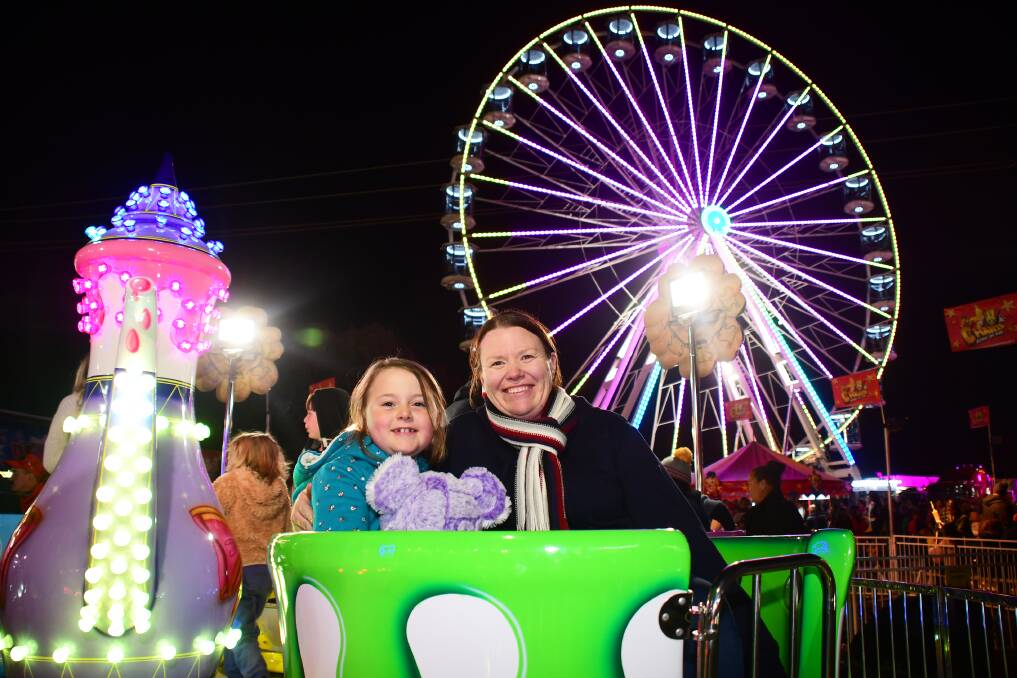 SHOWTIME: Olivia and Tracey Lowther ejoying the rides. Photo: AMY McINTYRE