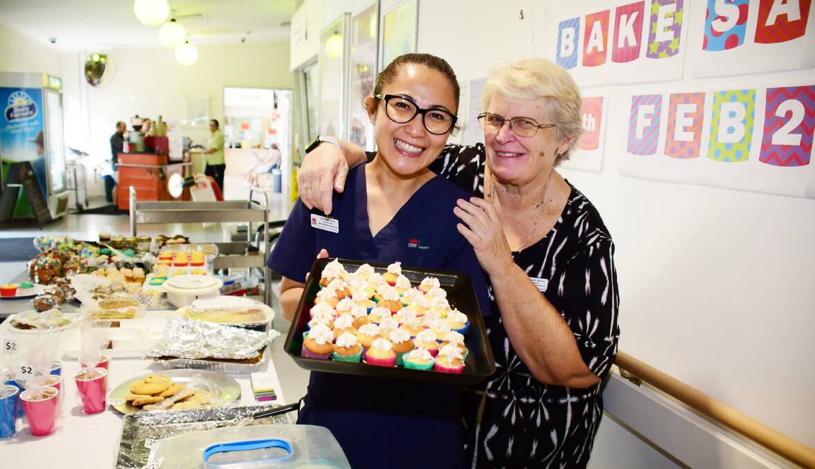 YUM YUM: Dubbo Hospital's Mayrah Jarry and Kaye Simpson organised the sale to raise money after the recent fires. Photo: AMY McINTYRE