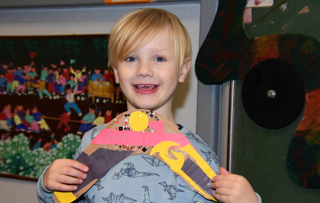 PROUD: Cash Etcell proudly shares his boomerang, decorated all by himself. Photo: AMY McINTYRE. 