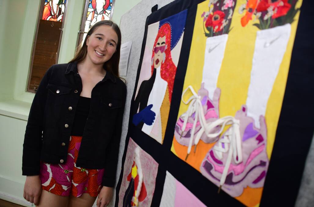 REFLECTION OF SOCIETY: Meg McKinney with her textile art 'The Society'. Photo: AMY McINTYRE. 