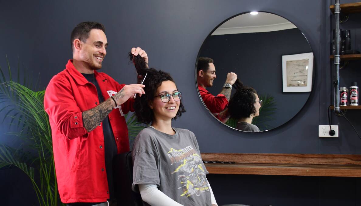 Fundraiser: Too Tapered barber Daniel Schaefer with Bella Ulgiati, who will have her head shaved on June 26. Photo: Amy McIntyre