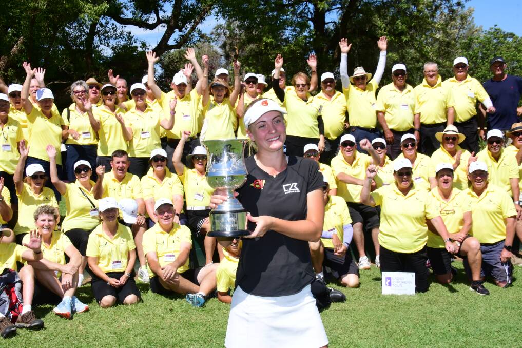 MASSIVE EFFORT: Julia Engstrom holds up her trophy surrounded by Dubbo's volunteer army. Photo: Amy McIntyre